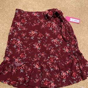 Brand new wraparound mini skirt dark Mauve with flowers